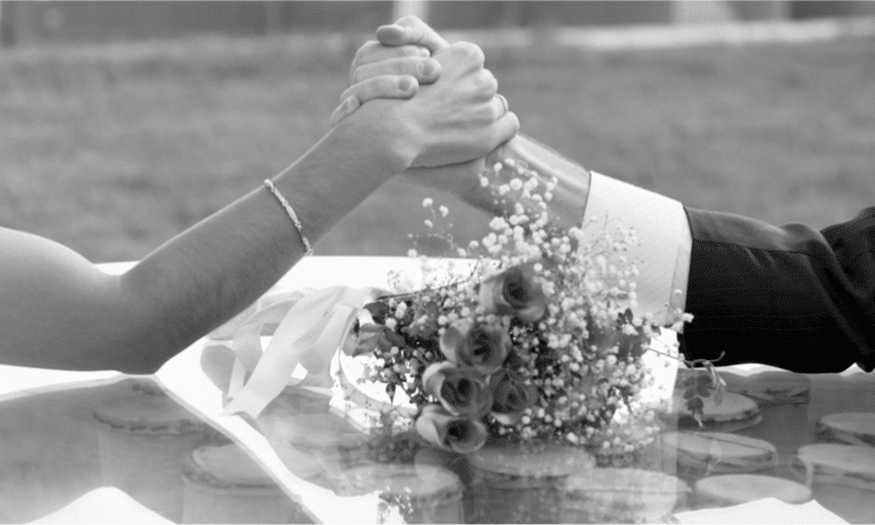 bride and groom holding hands